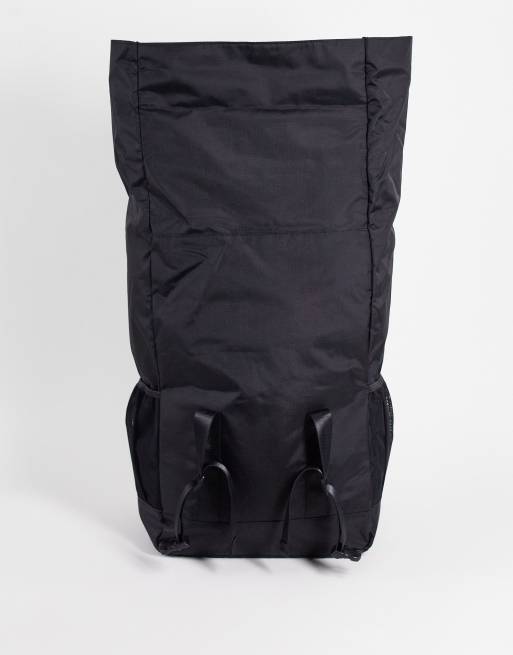 ASOS DESIGN oversized backpack with roll top and front pocket in black nylon