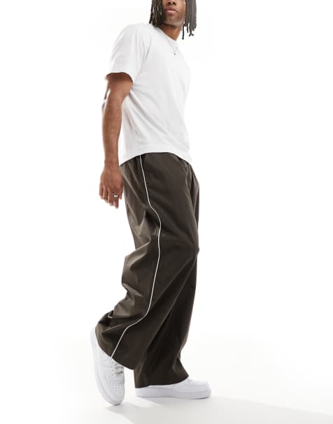 ASOS DESIGN oversized baggy pants with side piping in brown - view 1