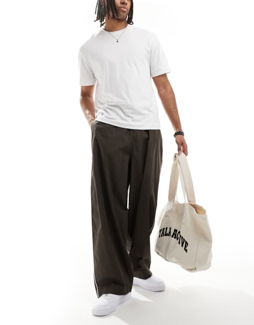 ASOS DESIGN oversized baggy pants with side piping in brown 