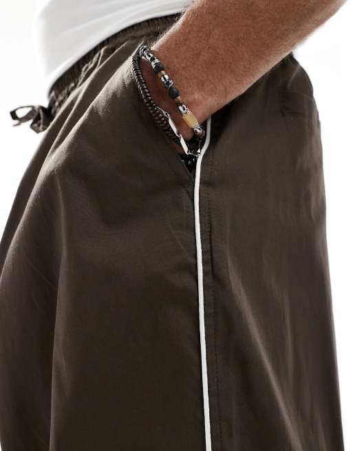 ASOS DESIGN oversized baggy pants with side piping in brown 