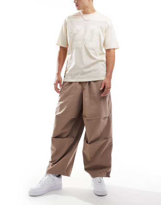 ASOS DESIGN - Oversized baggy parachutebroek in zandkleur met wassing 