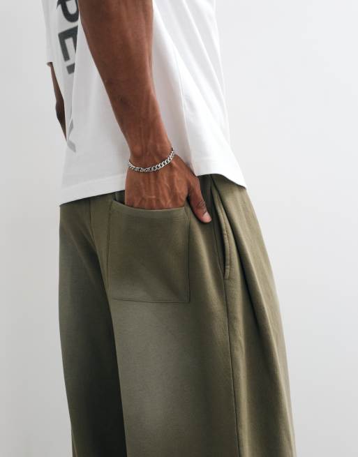 ASOS DESIGN oversized ballonjogger met plooien en spraywash in kaki, 4 van 9