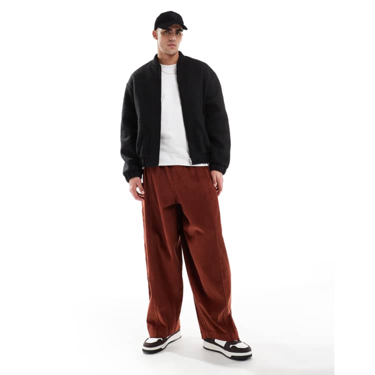 ASOS DESIGN oversized balloon cord pants in orange with side pockets