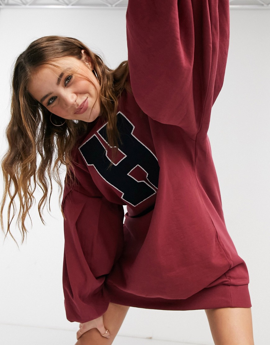 ASOS DESIGN oversized balloon sleeve sweat mini dress with letter graphic in burgundy and navy-Red