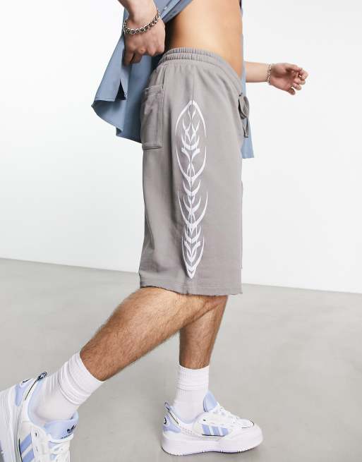 ASOS DESIGN oversized basketball shorts in gray with side print and nibbling