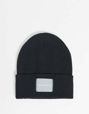 ASOS DESIGN oversized beanie in black with woven label - ASOS Price Checker