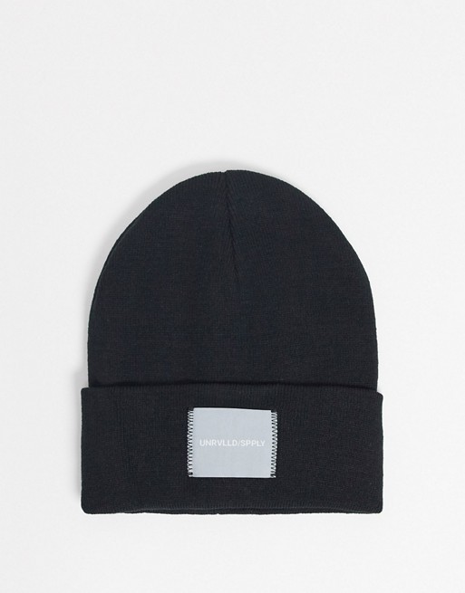 ASOS DESIGN oversized beanie in black with woven label
