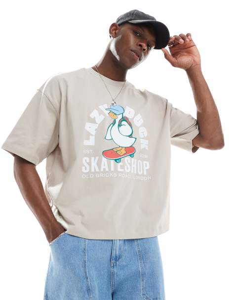 ASOS DESIGN - Oversized beige T-shirt med firkantet pasform og tegneserieprint - view 1