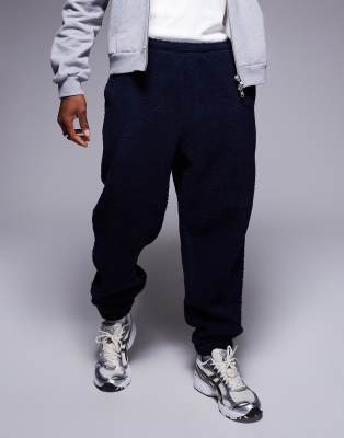 ASOS DESIGN oversized borg joggers in navy