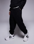 [ASOS DESIGN] ASOS DESIGN oversized borg trackies in black M black