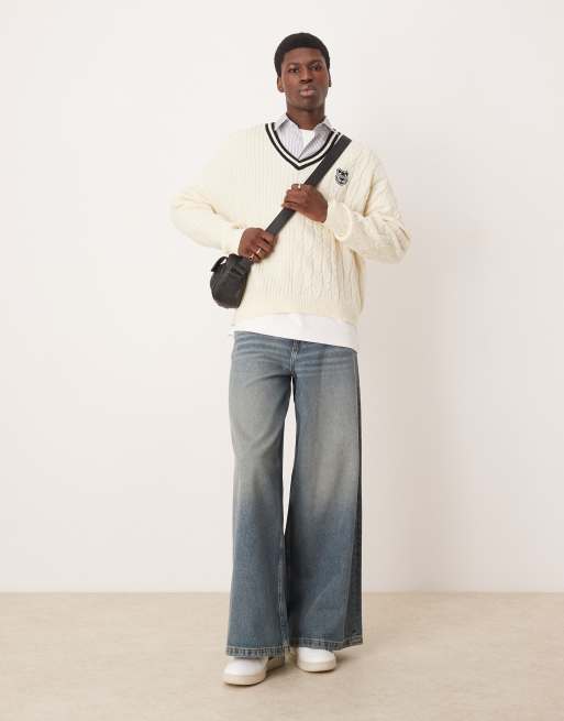 ASOS DESIGN oversized boxy fit contrast cable knit sweater with varsity badge in cream