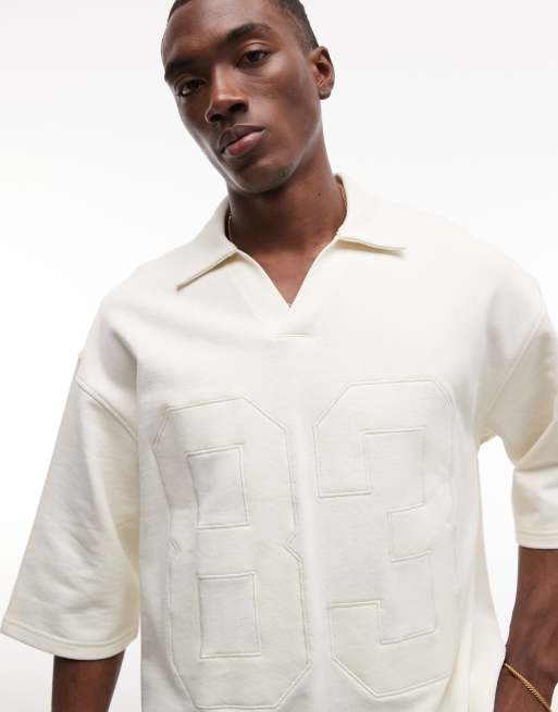 ASOS DESIGN oversized boxy fit polo shirt with appliqué detail in cream, 3 of 5