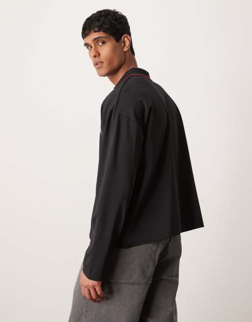 ASOS DESIGN oversized boxy polo t-shirt with sport design in black, 4 of 4
