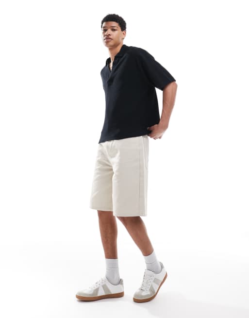 ASOS DESIGN oversized boxy textured revere collar polo shirt in black