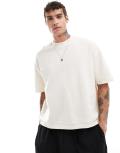 ASOS DESIGN oversized boxy waffle t-shirt with hem band in cream-White