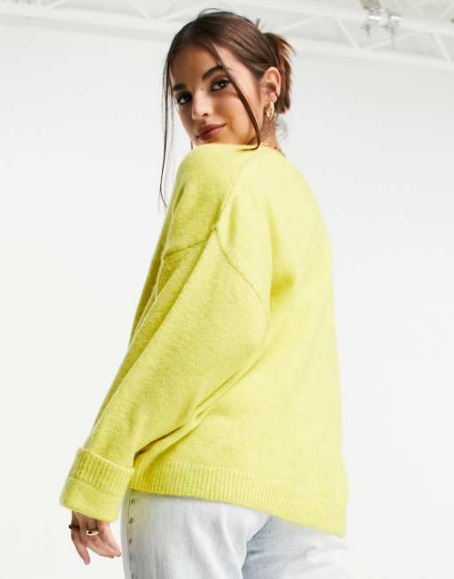 ASOS DESIGN oversized cardigan with turnback cuff and pocket in yellow