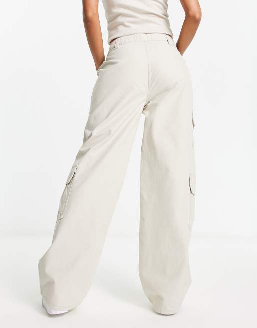 ASOS DESIGN oversized cargo pants with multi pocket in stone