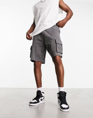 ASOS DESIGN oversized cargo shorts in black acid wash