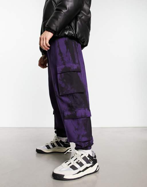 ASOS DESIGN oversized cargo trackies in purple and black tie dye