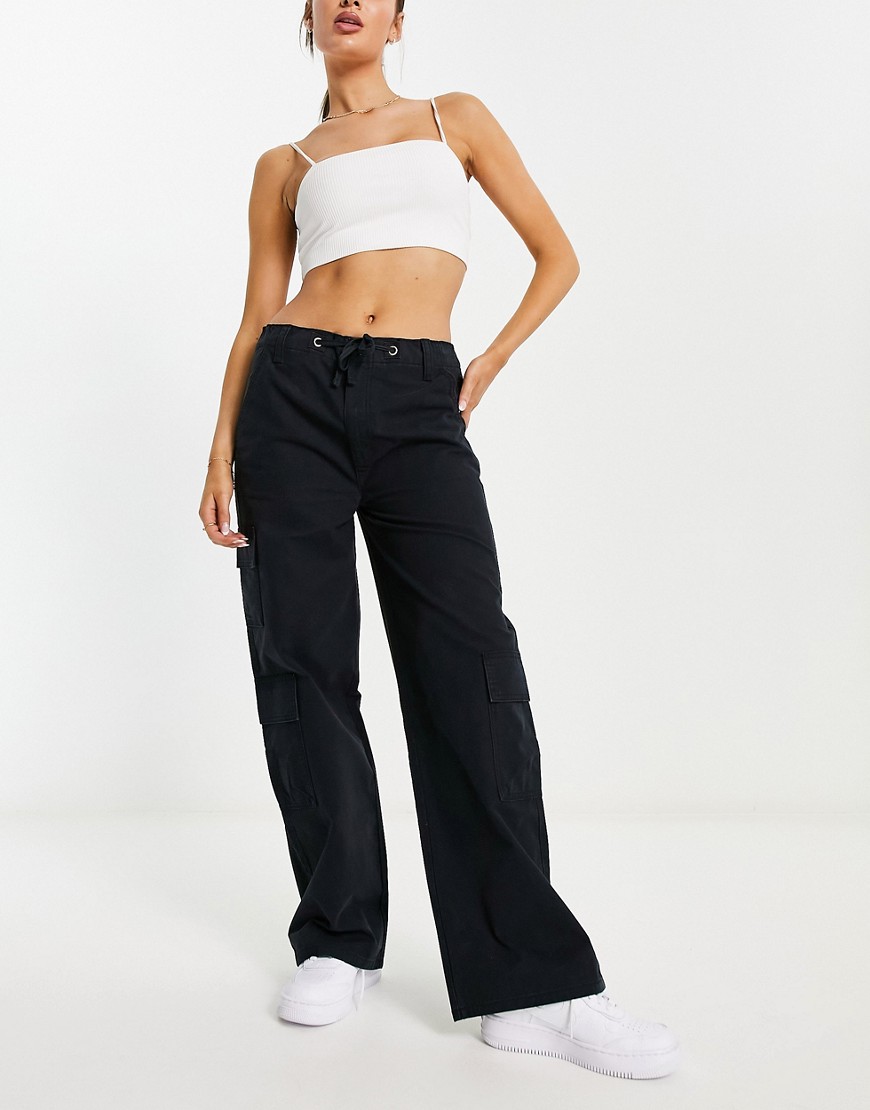 ASOS DESIGN oversized cargo trouser with multi pocket and tie waist in black