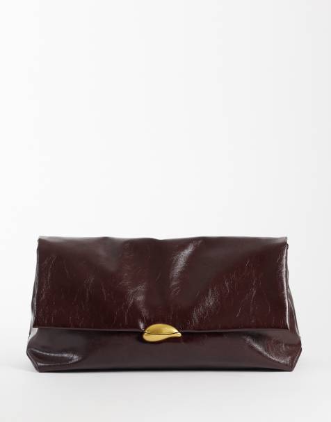 ASOS DESIGN oversized clutch in burgundy with hardware detail - view 1