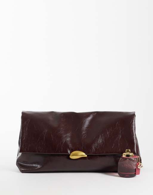 ASOS DESIGN oversized clutch in burgundy with hardware detail, 2 of 4