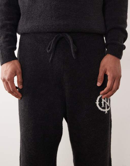 ASOS DESIGN oversized co-ord knitted cuffed joggers with NYC logo in washed black, 5 of 5