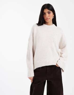 ASOS DESIGN oversized crew neck jumper with curved hem in cream