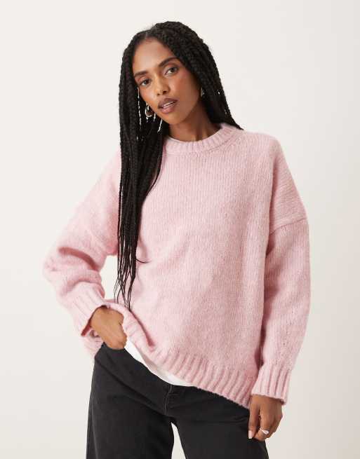 ASOS DESIGN oversized crew neck jumper with curved hem in pink