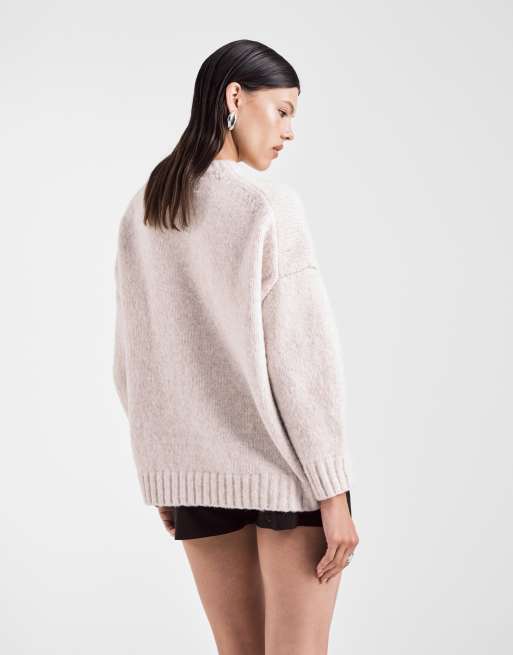 ASOS DESIGN oversized crew neck sweater with curved hem in cream