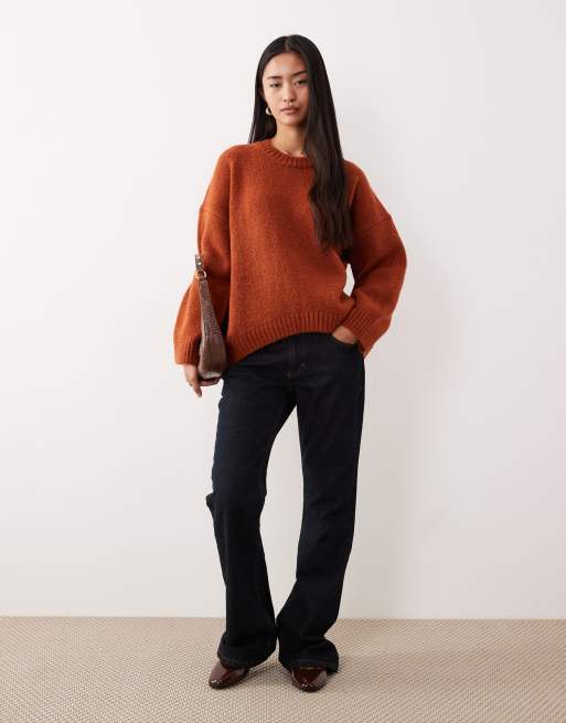 ASOS DESIGN oversized crew neck sweater with curved hem in rust