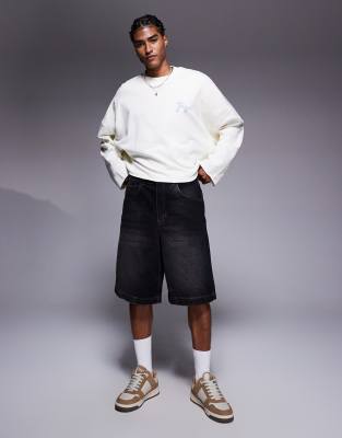 ASOS DESIGN oversized cropped sweatshirt with raw hem and chest print in white