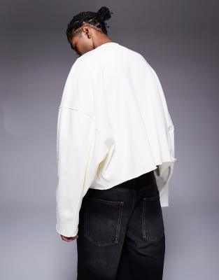 ASOS DESIGN oversized cropped sweatshirt with raw hem and chest print in white