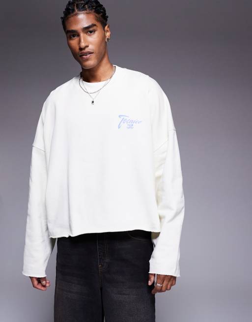 ASOS DESIGN oversized cropped sweatshirt with raw hem with chest print in white