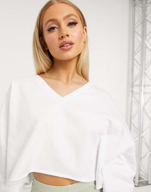 ASOS DESIGN oversized cropped sweatshirt with v neck in white