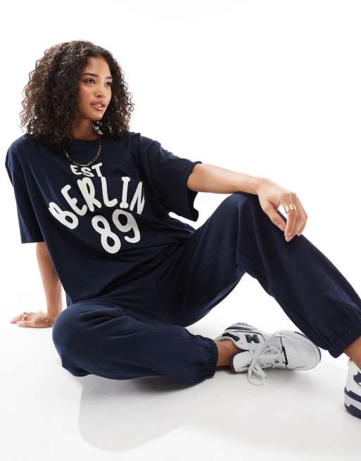 ASOS DESIGN oversized cuffed jogger co ord with applique berlin graphic in navy