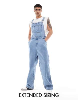 ASOS DESIGN oversized denim dungaree in mid wash blue φωτογραφία