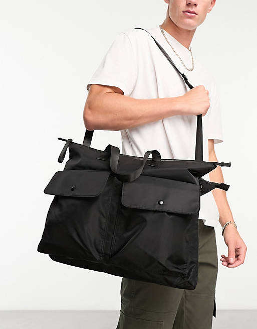ASOS DESIGN oversized double pocket cross body bag in black | ASOS