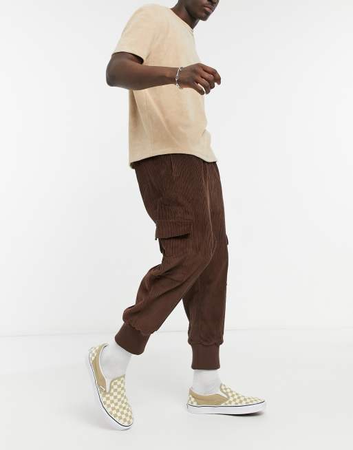 ASOS DESIGN oversized drop crotch pants with cargo pockets & jersey cuffs in brown cord