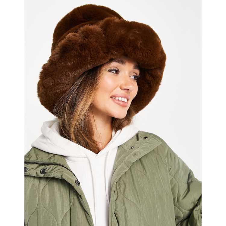 ASOS DESIGN trapper hat with badge in brown faux fur