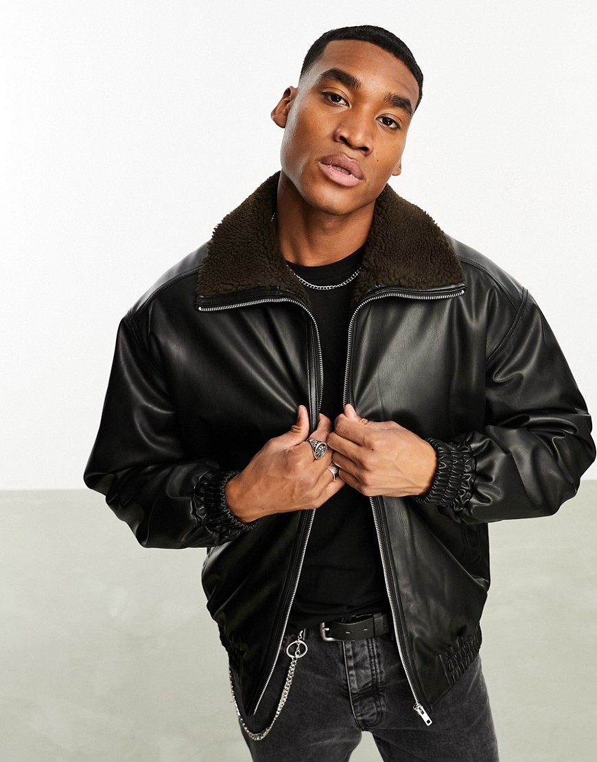 ASOS DESIGN oversized faux leather bomber jacket in brown with borg lining-Black
