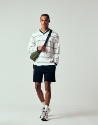 ASOS DESIGN oversized fit jersey shorts with pintucks in black | ASOS