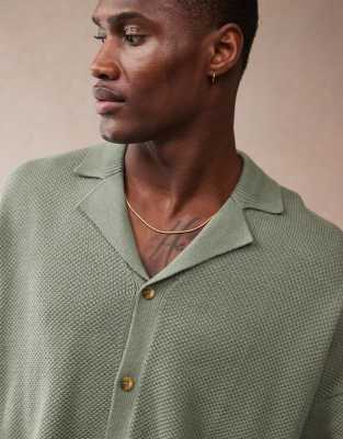 ASOS DESIGN oversized boxy fit knitted texture revere neck button through polo in green