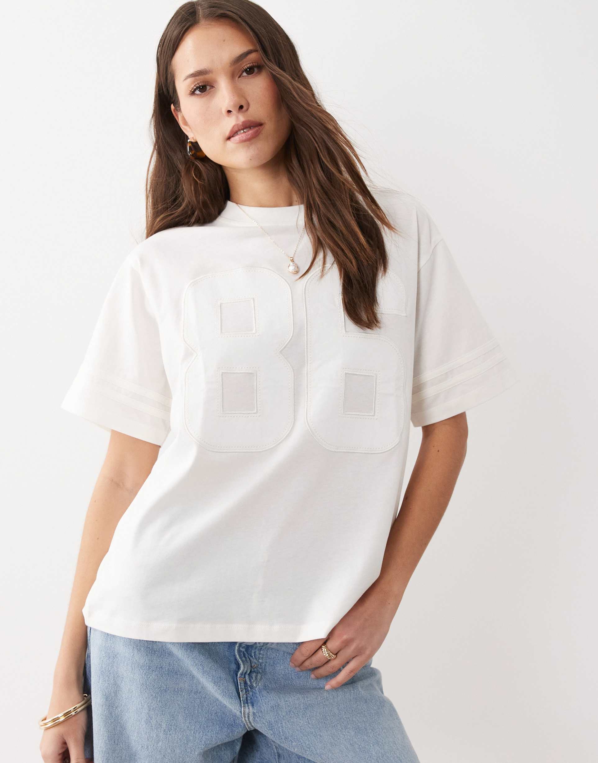 asos design oversized football t-shirt with raised 86 varsity graphic in cream