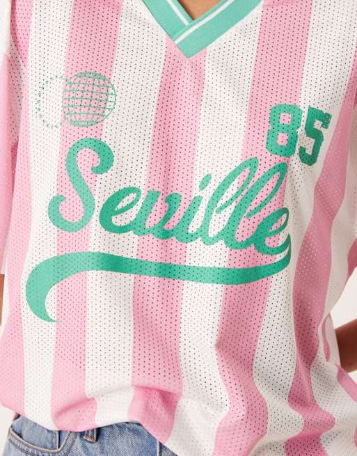 ASOS DESIGN oversized football T-shirt with seville graphic in pink and green