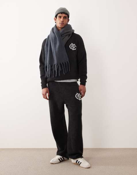 ASOS DESIGN - Oversized gebreide joggingbroek met boorden en NYC logo in zwart met wassing, deel van co-ord set - view 1