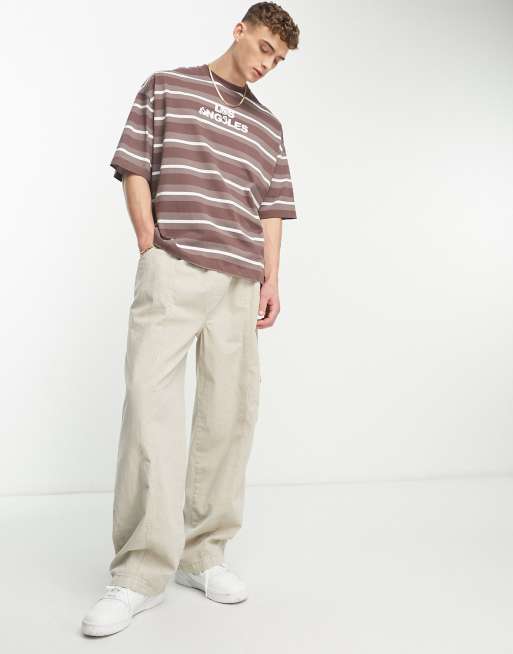 ASOS DESIGN - Oversized gestreept T-shirt in bruin en wit met 'Los Angeles' stadsprint