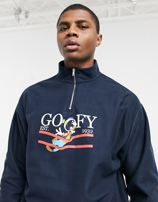 ASOS DESIGN oversized half zip sweatshirt in polar fleece with Disney Goofy print in navy