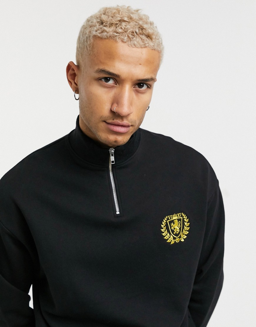 ASOS DESIGN oversized half zip sweatshirt with crest logo print in black