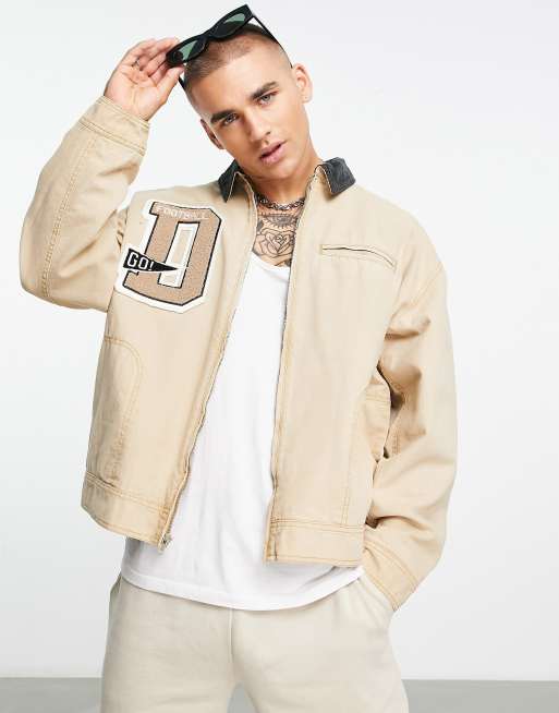 ASOS DESIGN - Oversized Harrington jack met varsity embleem en corduroy kraag in beige